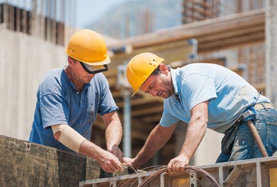 Construction workers in the middle of a project.